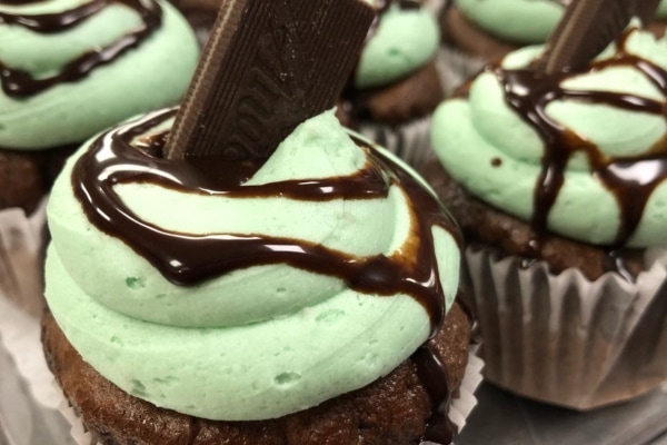 Mint chocolate cupcakes topped with an andes mint.