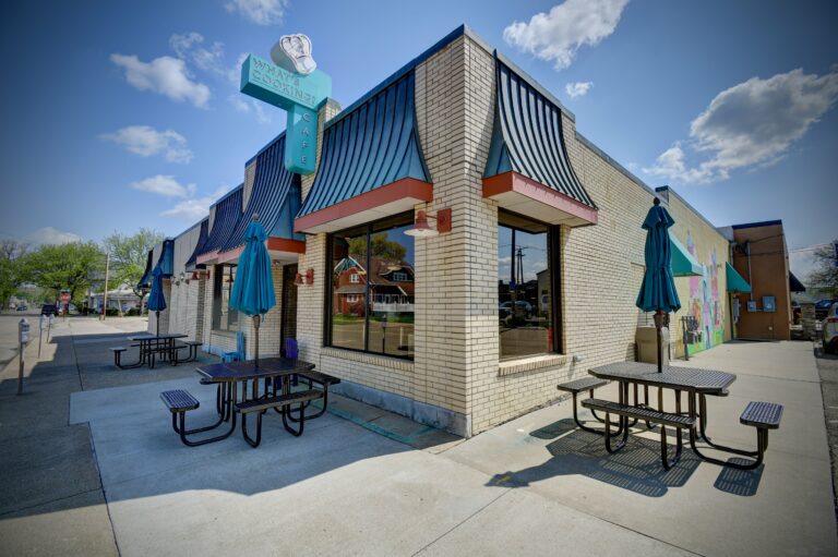 Exterior image of What's Cooking Cafe with outdoor seating.